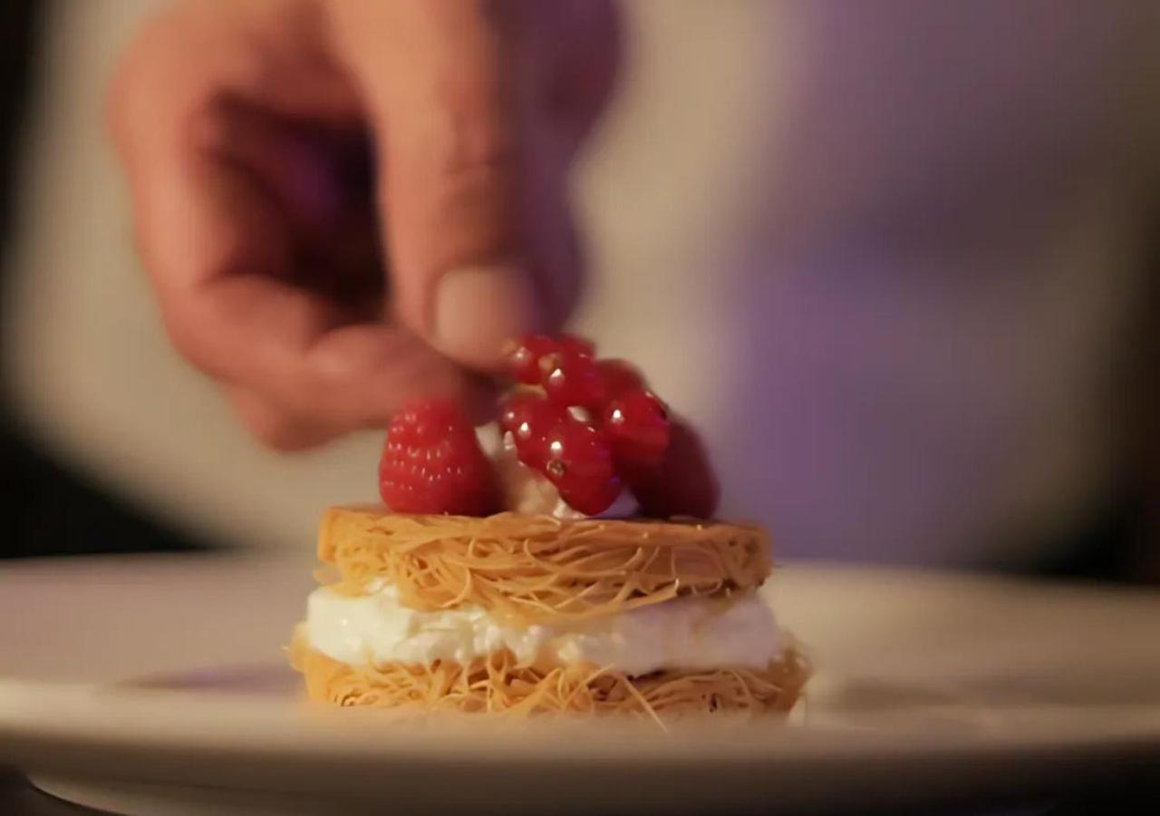 Gefinor Rotana - Beirut Hotel Bagian luar foto A pastry chef finishing a dessert